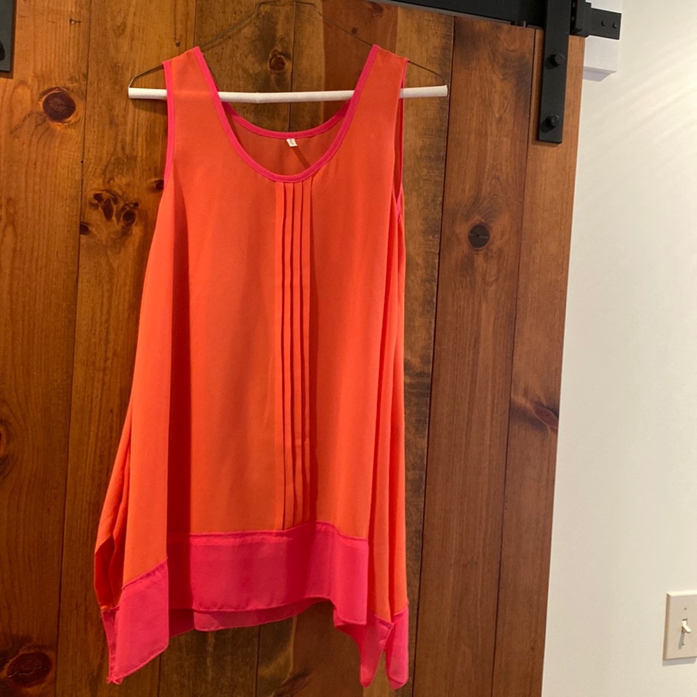 Boutique sleeveless blouse in bright orange and hot pink, size L.